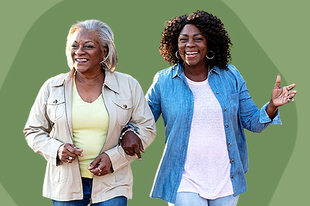 Mother and daughter walk arm in arm with green background