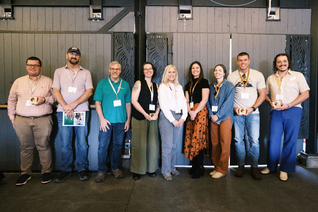 The 2024 Innovation spotlight award winners standing in a row holding their awards in their hands