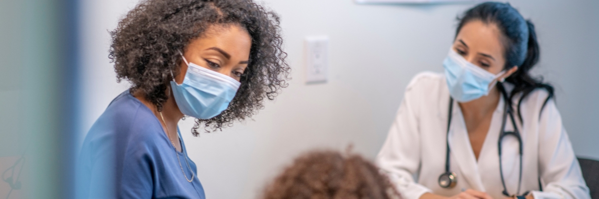 Black mother and her daughter at a doctor's office
