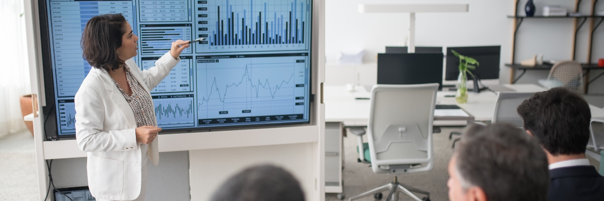 Doctor gestures at data pulled up on screen