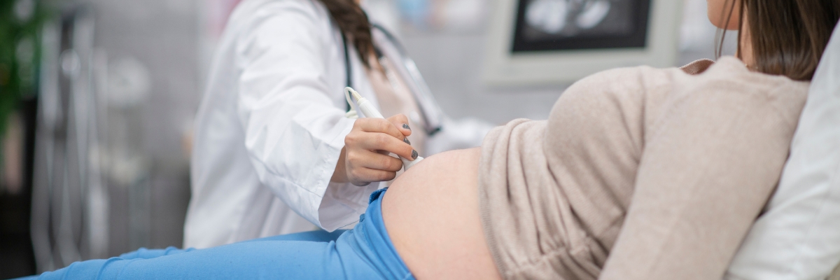 Pregnant person receiving an ultrasound