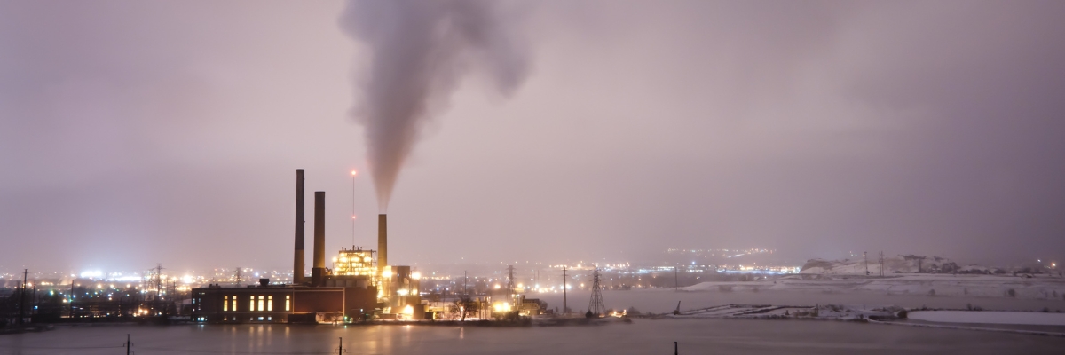 Oil refinery releases smoke into the sky