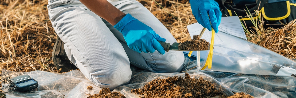 Someone taking soil samples