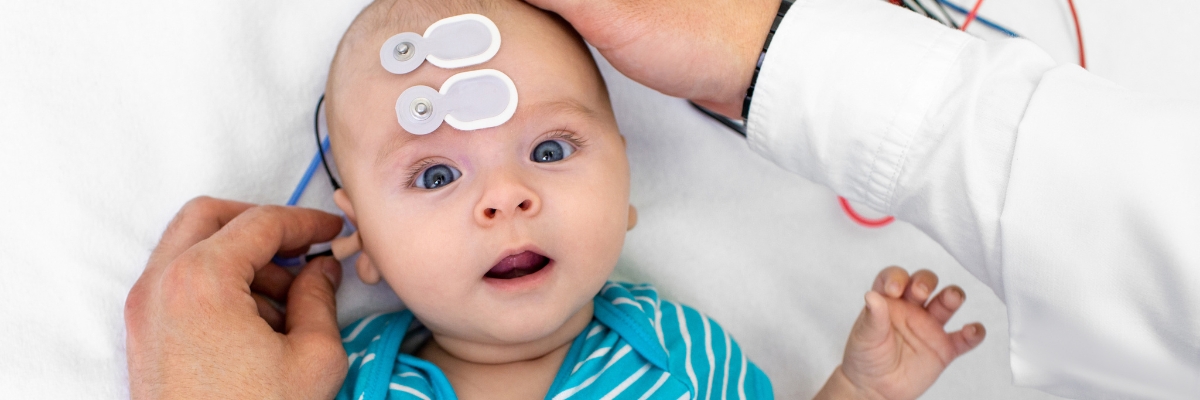 Infant having their hearing tested
