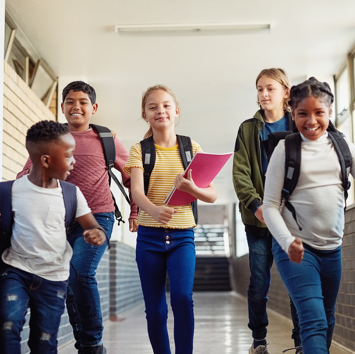 smiling children walking in hallway