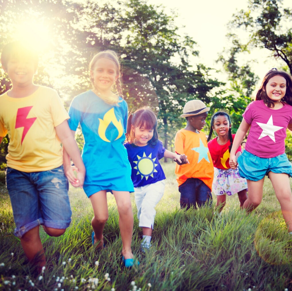 kids walking in a field