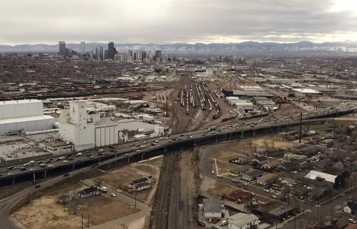 Aerial view overlooking downtown denver, I-70, and the train depot in Commerce City-North Denver