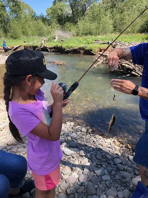 A girl participating in one of the fishing educational events. Photo credit to the Alamosa River Foundation.