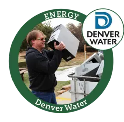 Denver water award winner, a person putting a computer tower into a big bin