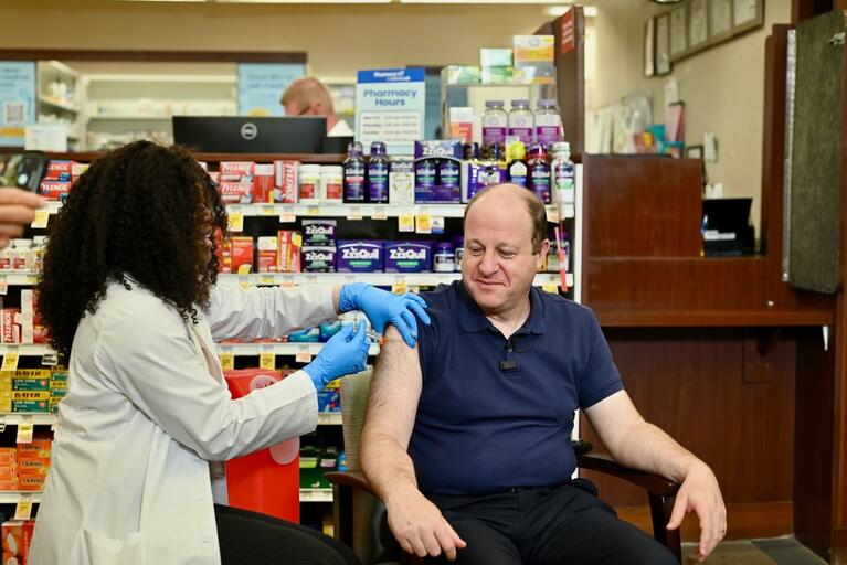 Gov. Polis gets vaccinated at pharmacy