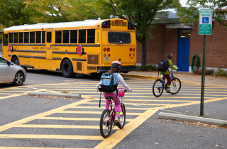 School bus and children on bikes