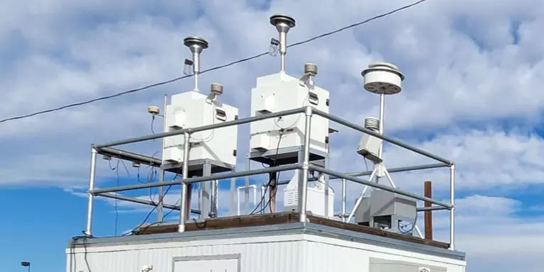Colorado Air Toxics Trends Station (COATTS) monitoring site, includes a small building with samplers visible on the roof