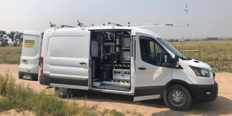 Mobile Optical Oil and gas Sensor of Emissions or MOOSE mobile monitoring van with doors open to display the air monitoring instruments inside