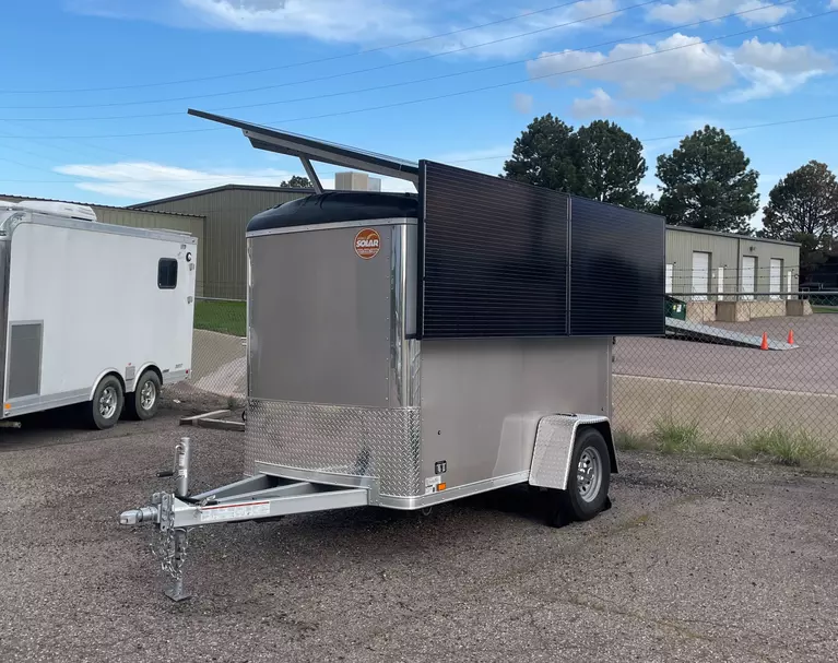 Solar-powered modular trailer, outfitted with solar panels on the side and top