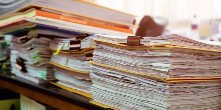 Stock image of a stack of reports