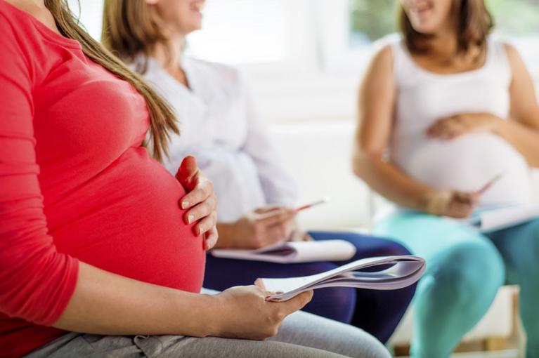 group of pregnant women sitting down talking